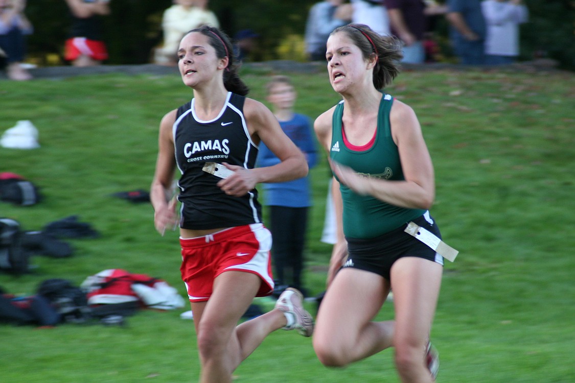 Jackie Premo outkicks an Evergreen runner to the finish line Oct. 12, at Vancouver Lake.