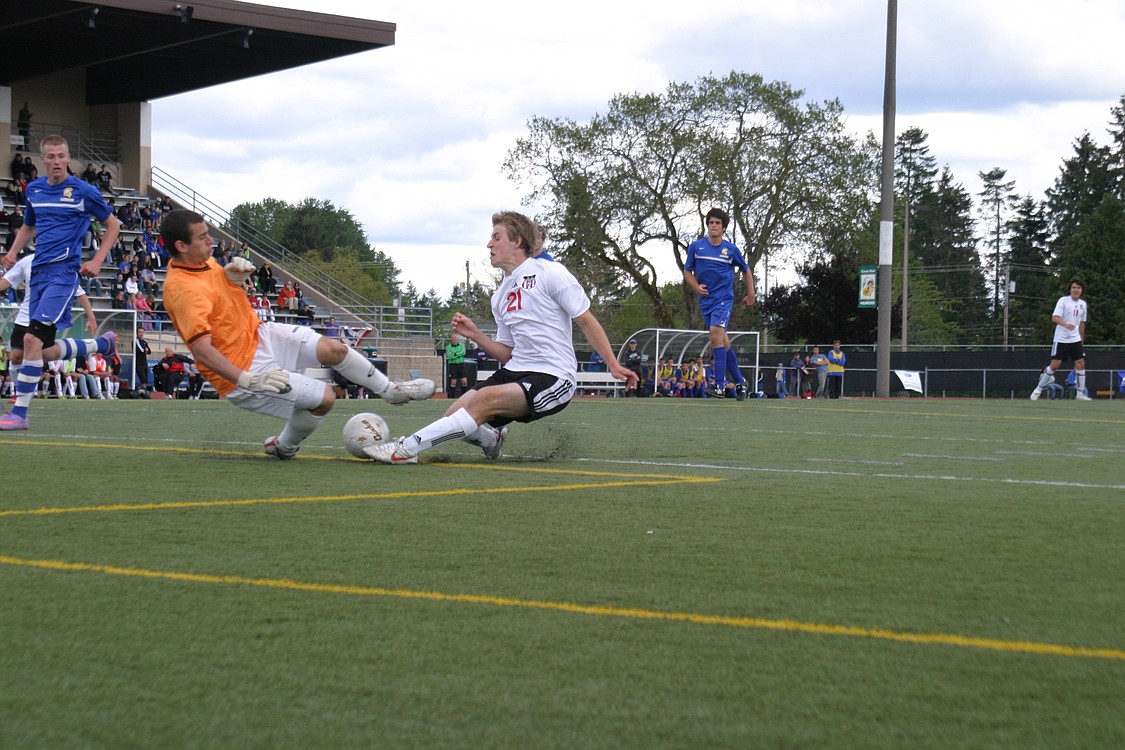 Nathan Beasley gives the Bainbridge goalkeeper a scare.