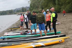 Activity is bustling along Cottonwood Beach during Sunday's Salmon Classic stand up paddleboarding event, at Capt. William Clark Park in Washougal.