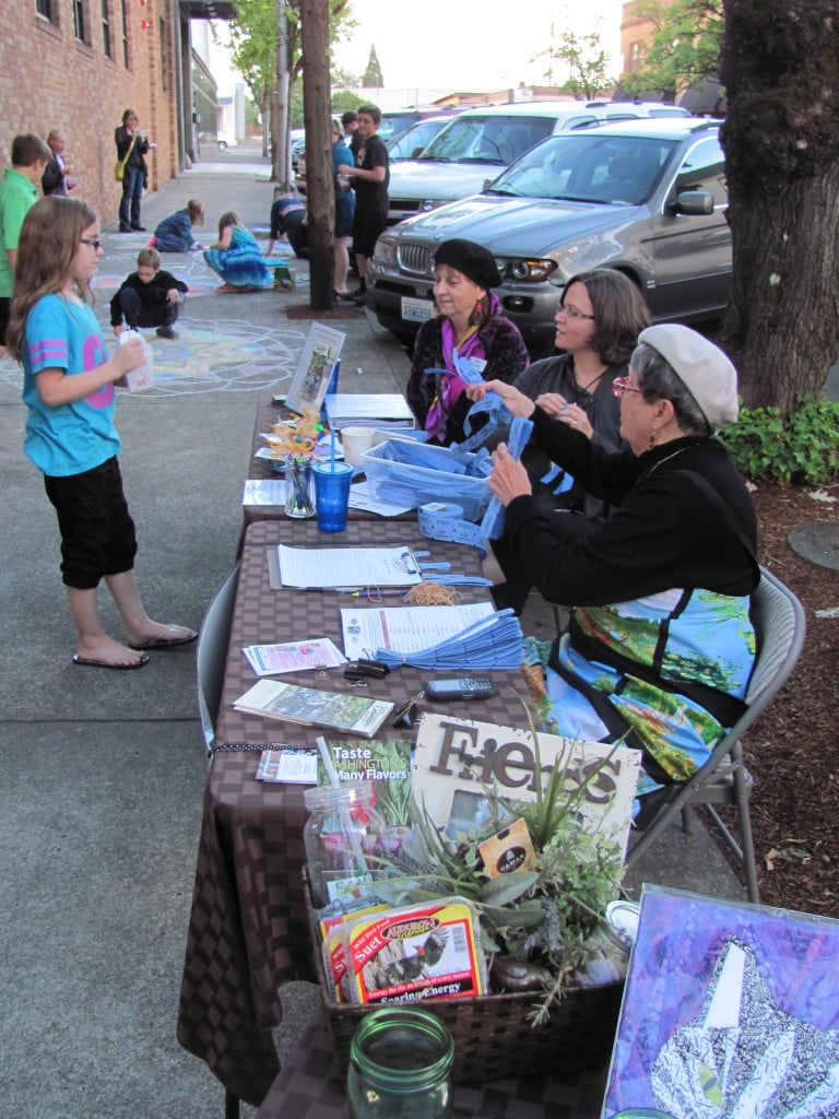 Kitty Hibbs, Jamie Morin and Carol Alice (left to right) explained to First Friday visitors how tickets are obtained by visiting participating businesses in downtown Camas. The tickets can then be entered to win prizes from merchants. Hibbs, Morin and Alice are volunteers with the Downtown Camas Association. 