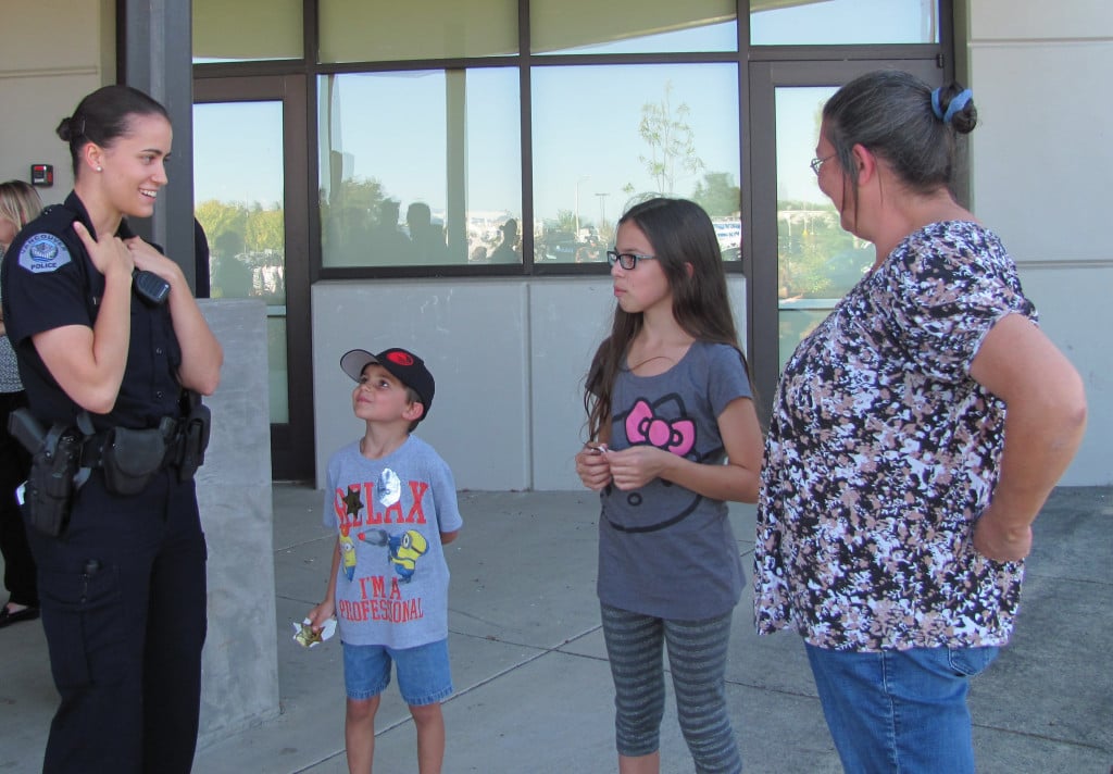 Patrol officer Katie Endresen chats with attendees during the Girl Cops are Awesome event. "I would have absolutely loved to have something like this when I was younger," she said. 