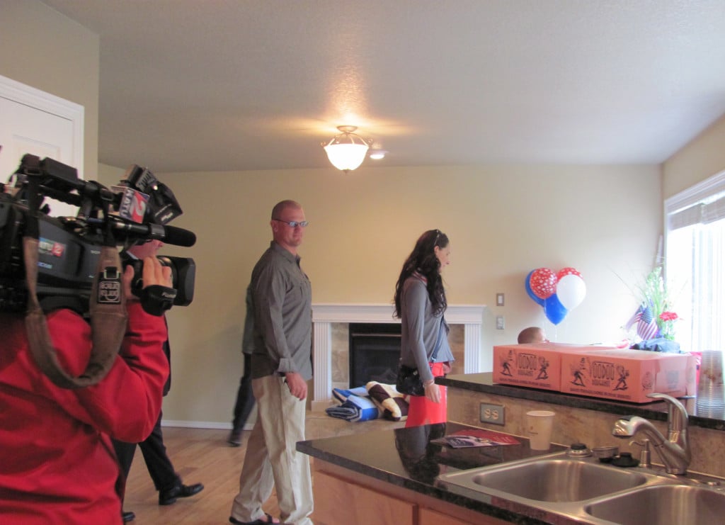 The Collins family inspects the kitchen in their newly remodeled Washougal residence. It is the sixth home donated to an injured veteran though a partnership between U.S. Bank, Feedom Alliance and Five Brothers.                                