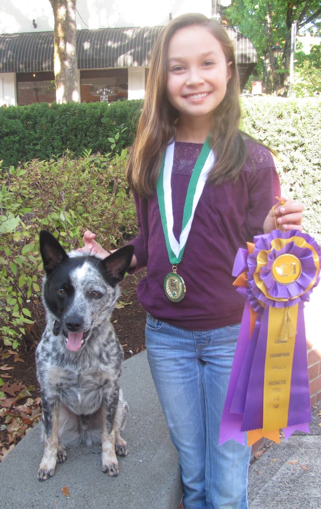Taylor Rhodig of Washougal and her dog, Colby, recently took first-place in the junior showmanship category at the Washington State Fair. They belong to the Mutts and Masters 4-H Club, comprised of East Clark County residents. 