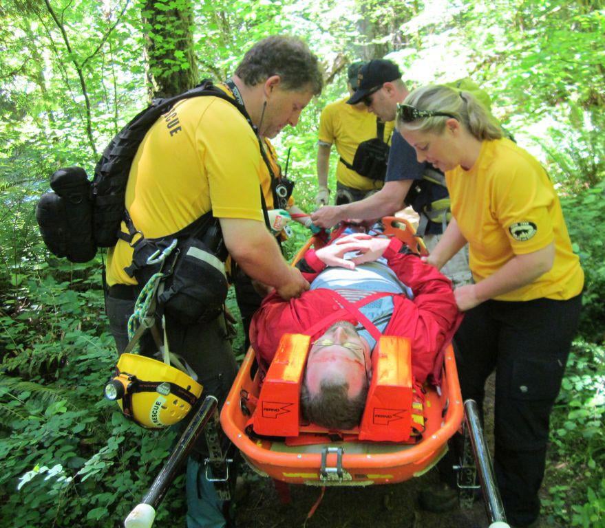 Past Silver Star Search and Rescue President Chris Schole volunteers to be a "patient" during a training exercise at Round Lake. 