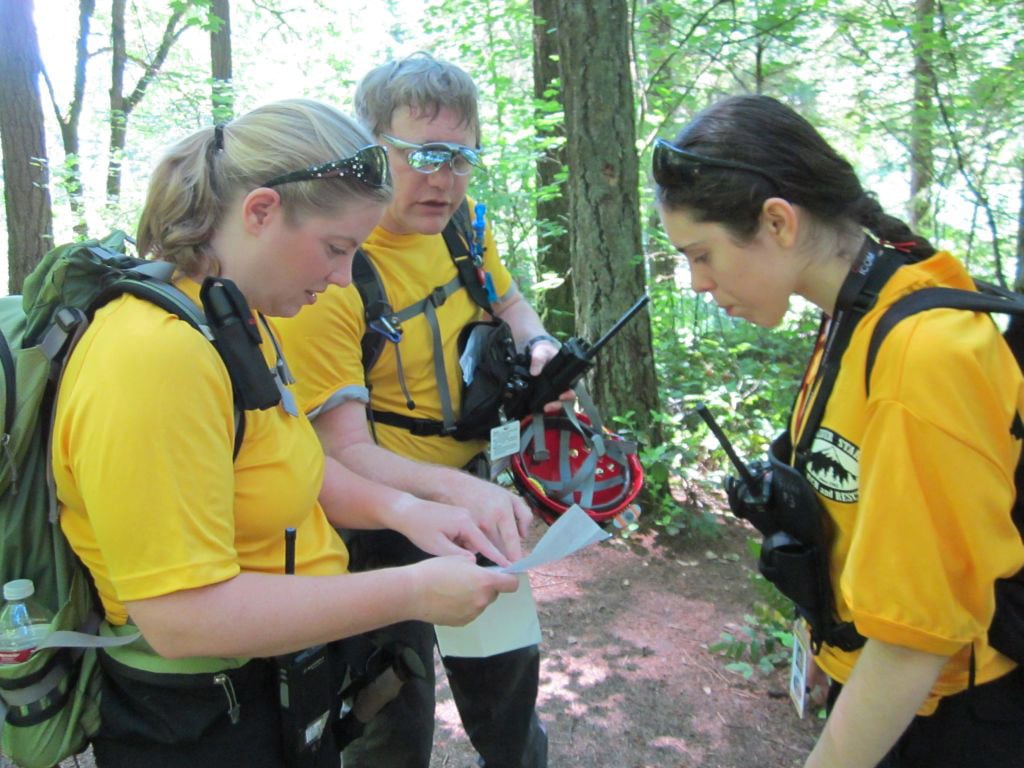  Silver Star Search and Rescue members practice map and compass navigation on the trails near Round Lake.                               
