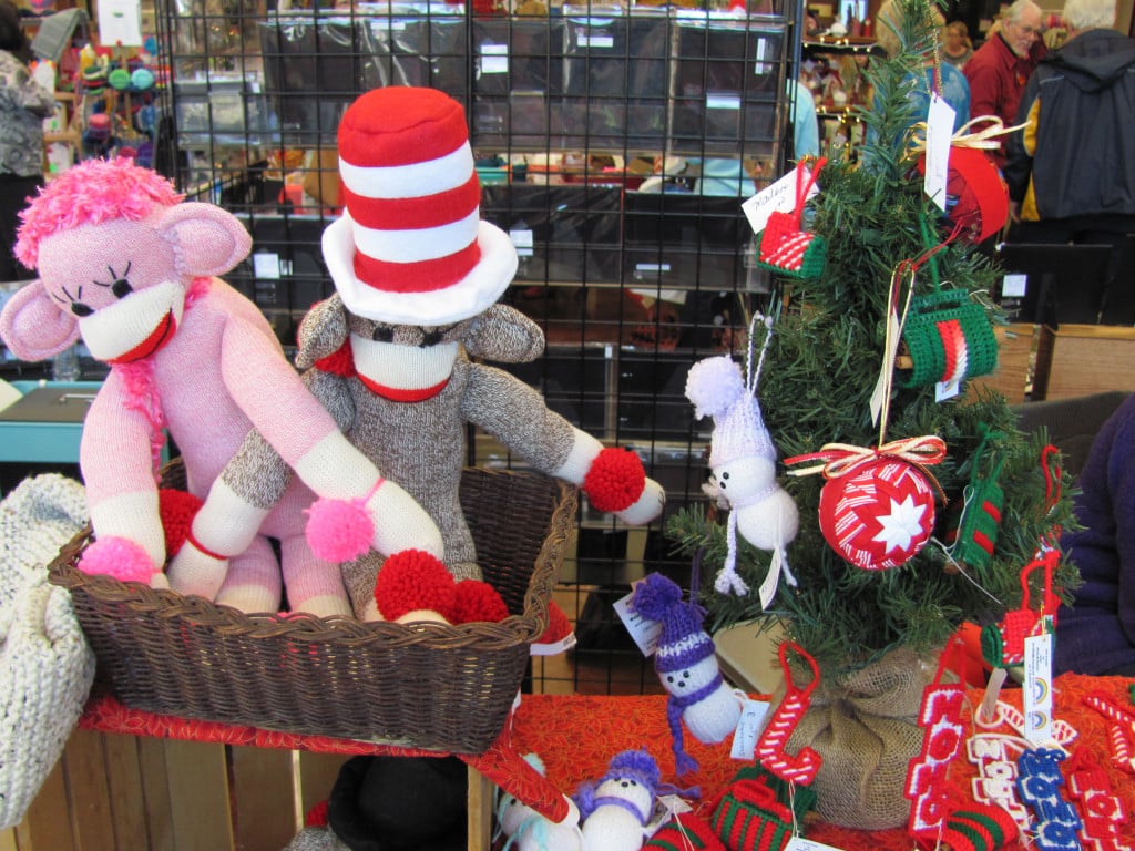 Colorful sock monkeys, along with hand-kniitted ornaments, adorned one booth at a local bazaar last season. 