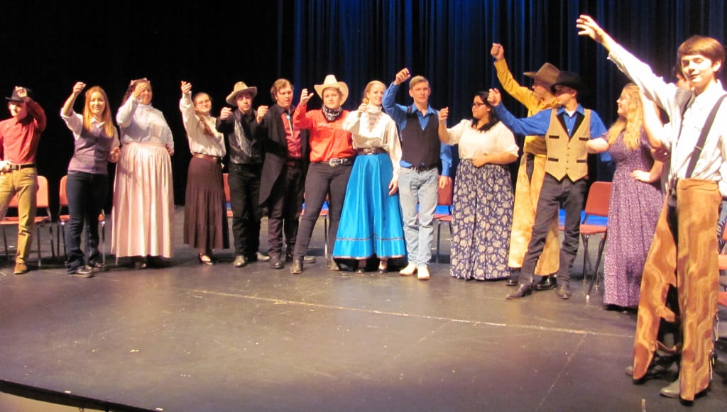 The Tamin' of the Shrew cast toasts the marraige of Lucentio and Bianca. 