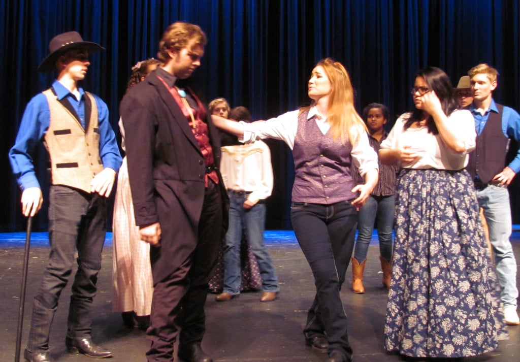  Petruchio (Tristan Fackler) and Tranio (Sydney Valaer) argue about his choice of clothing.                               