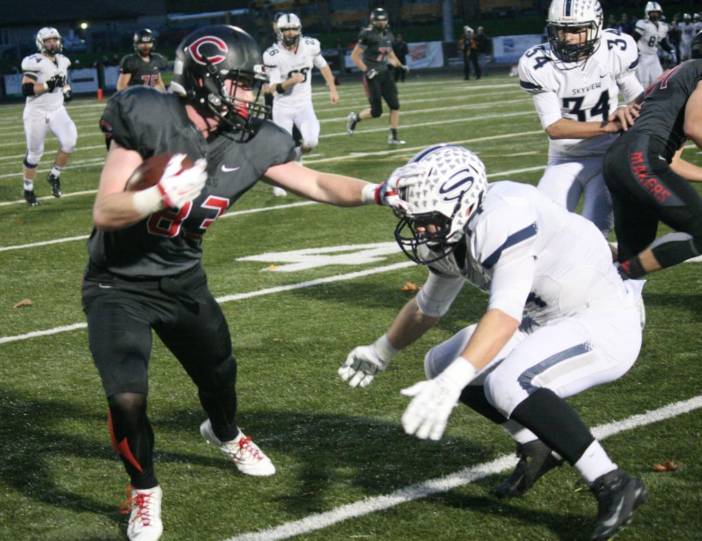 Camas High School senior Blake Roy stiff arms the defender from Skyview and keeps going down the field.