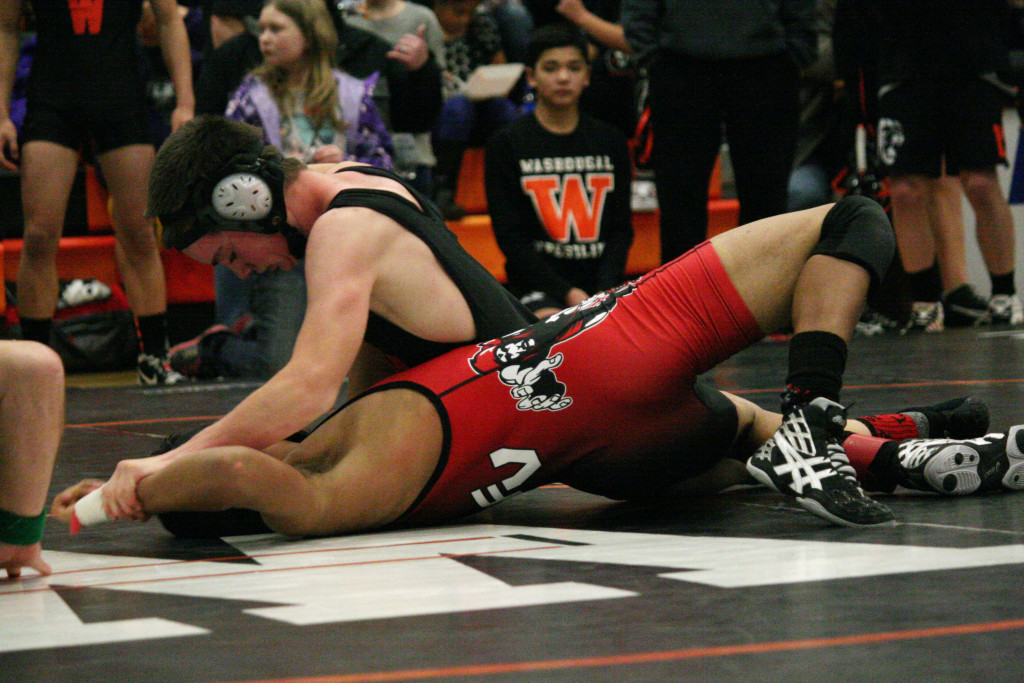 Washougal wrestler Tanner Klopman pins Fort Vancouver's Justin Miller's shoulders to the mat to win his semifinal match at the Washougal River Rumble Saturday, at Washougal High School. Klopman clinched the 113-pound championship for the Panthers.