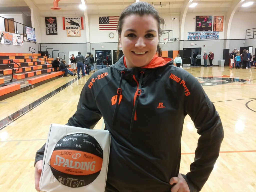 Alyssa Blankenship received a sweatshirt and a basketball signed by teammates and coaches for surpassing 1,000 career points for Washougal High School.