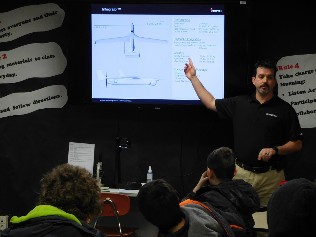 John Walker, a logistics analyst with Insitu, an unmanned aircraft company, talks to students about the various uses of drones.