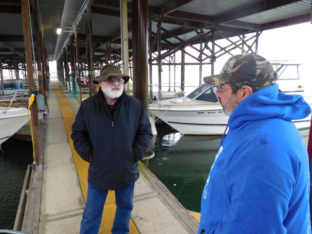 Ernie Stille (right) talked with fellow boater Mike Heltborg (left) Wednesday, about recent thefts from 11 boats moored at the Port of Camas-Washougal marina. Stille described boat owners -- who include fishing enthusiasts and pleasure boaters -- as family. "We look out for each others' stuff," he said. "Most of the people here have worked hard to get this." Stille suggested the port enable marina tenants to have access to Wi-Fi, so they could install their own security systems.