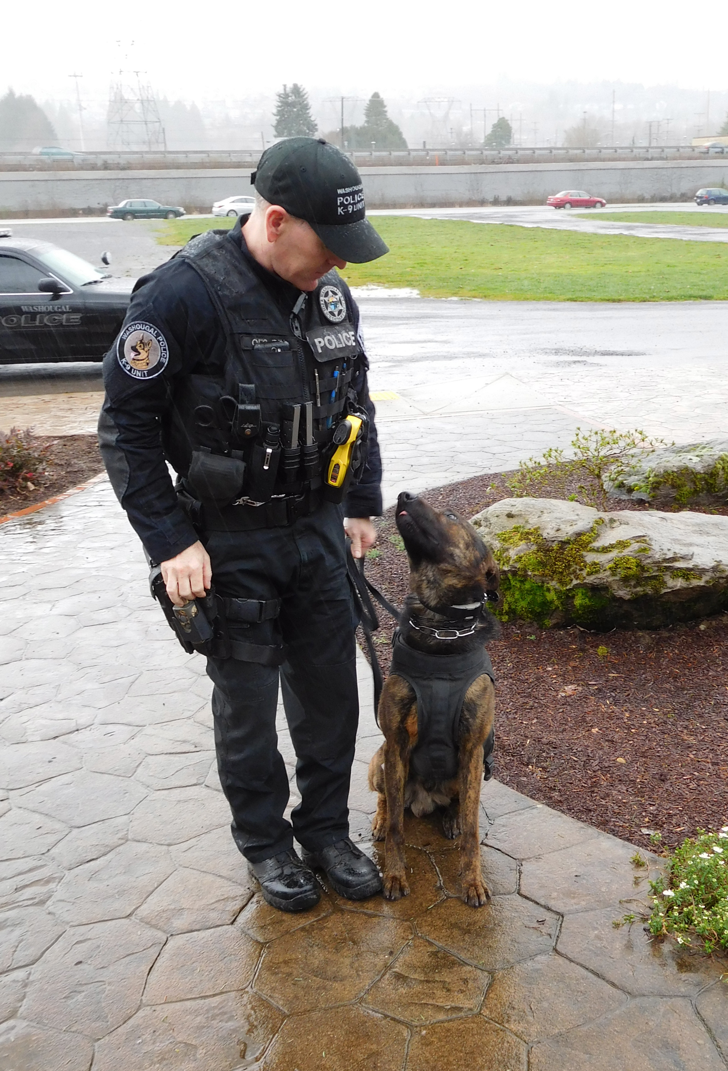 Washougal Police Officer Kyle Day and K-9 Officer Ranger take a brief break in Parker&#039;s Landing Historical Park, Friday afternoon. &quot;He is a great public relations tool and a conversation piece,&quot; Day said, regarding Ranger. &quot;He helps break down barriers. People share stories with me about their dogs.