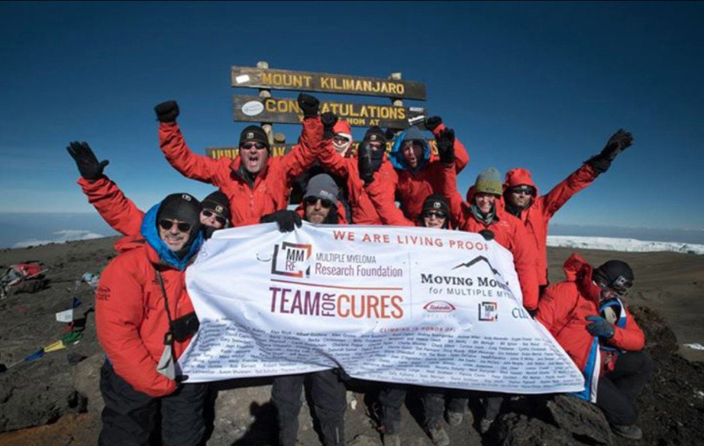 Camas resident Julie Ryan (center, back row) and twin sister Jana Cannon celebrate reaching the summit of Mount Kilimanjaro with their group from the Multiple Myeloma Research Foundation. "It was such an exhilarating experience," Ryan said. "It exceeded my expectations in every way."
