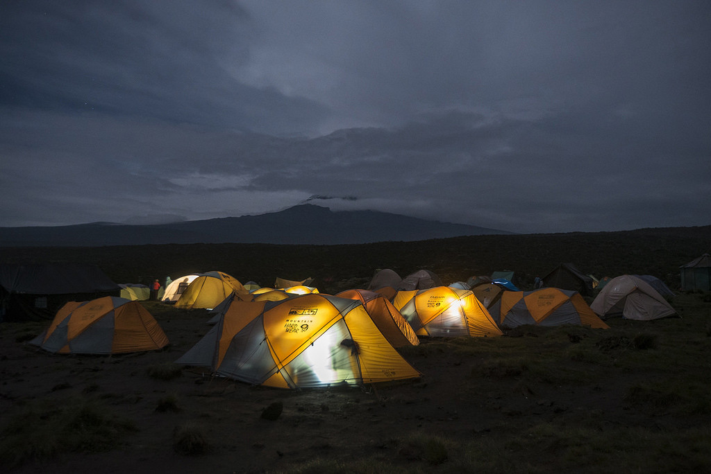 The Multiple Myeloma Research Team included people from all walks of life. Here, the group prepares to camp for the night, with Mount Kilimanjaro in the background.