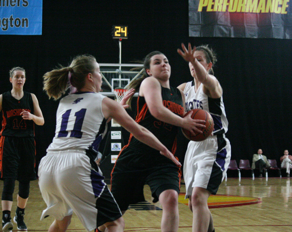 Alyssa Blankenship runs by two Anacortes Seahawks and scores two points Friday, at the Yakima Sun Dome. She scored 1,241 points in four years of high school basketball in Washougal, which is second all-time in the program's history. Blankenship was also named to the 2A all-state tournament team. 