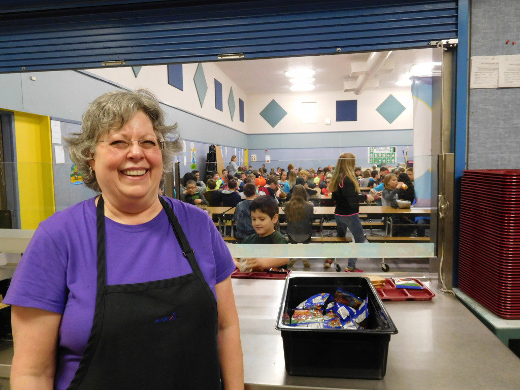 Sandy Bell has been working in food service for the Washougal School District for 10 years. Here, she serves students at Gause Elementary School.