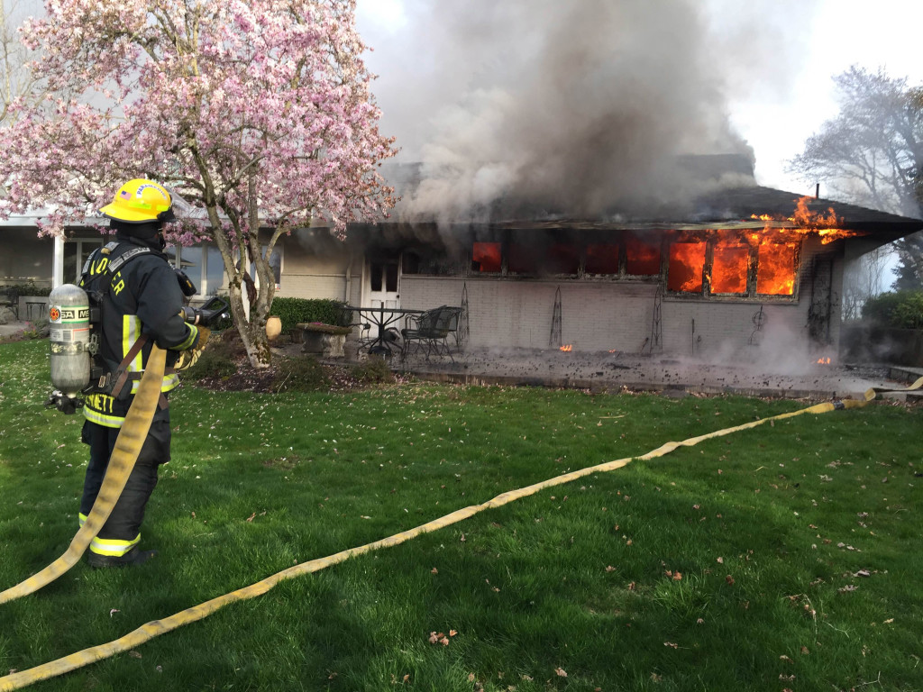 Firefighters battle a blaze that broke out this morning at 4108 N.W. McIntosh Road, in Camas. Initial efforts to put the fire out were challenged by the fact that there was no nearby fire hydrant. A 1,500-foot hose was needed to transport water to the scene. Photo courtesy of the Camas-Washougal Fire Department.