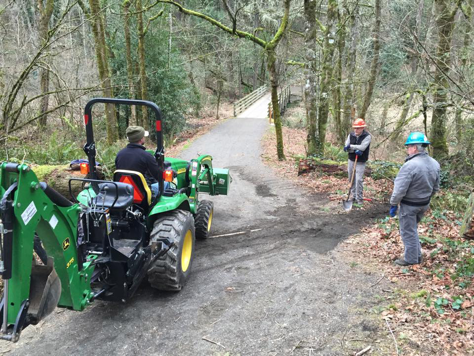 Volunteers fill ruts and replace water bars at the Round Lake trail. (Contributed photo)
