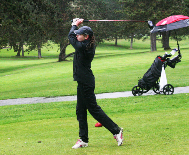 Hailey Oster crushes her last drive of the day at the Chieftain Invitational Thursday. The Camas High School sophomore shot a 78 on the par-72 Lewis River Golf Course, in Woodland, to win the 68-player tournament. 