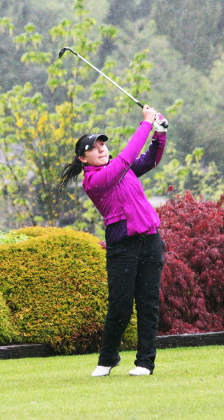Kallie Sakamoto watches her tee shot land on the 17th green at the Lewis River Golf Course Thursday. The Washougal High School sophomore also shot a 78, but settled for second place on a tiebreaker.