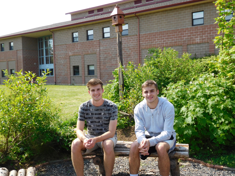 CHS students Seth Bradshaw (left) and Adam Ryan collaborated on their Eagle Scout projects to create benches, birdhouses and arbors, all made from reclaimed wood, in the garden at Skyridge Middle School. 