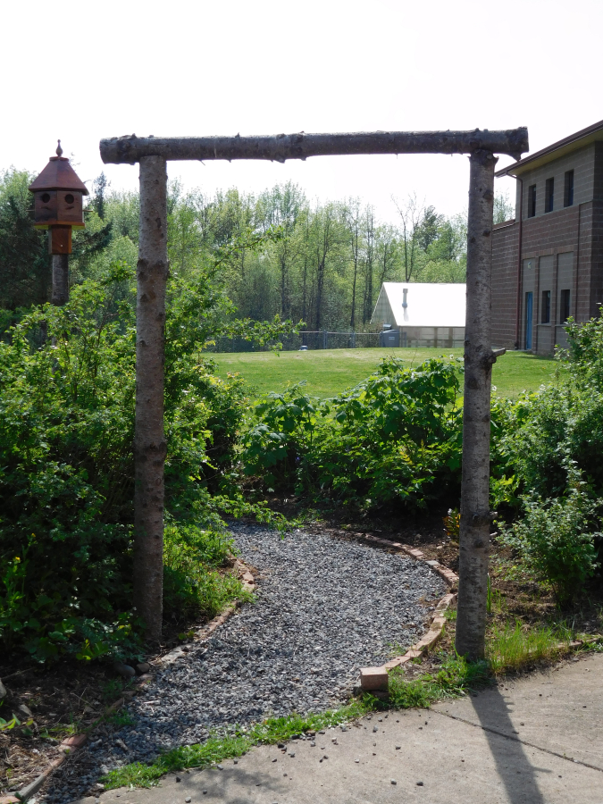 This arbor anchors the garden's entrance.