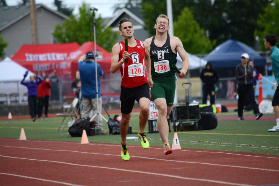 Adam Ryan passes by the Skyline anchor on the last 50 meters of the 1,600 prelim Thursday. Cade Greseth, Luke Albert, Dustin Zimmerly and Ryan won the race and dropped their school record time down to 3:21.56.