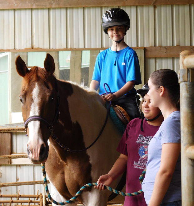 Jeremy Scher, 11, has been taking lessons at Son Rise Ranch for the past year. Cisco is the first horse he ever rode, and soon he will lease him.