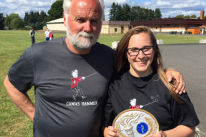 Haleigh Sudbeck stands with her coach, Hank Midles, after winning the Washington state hammer championship May 29, in Centralia. The Camas High School senior beat 20 competitors with a toss of 162-1. (Contributed photo)