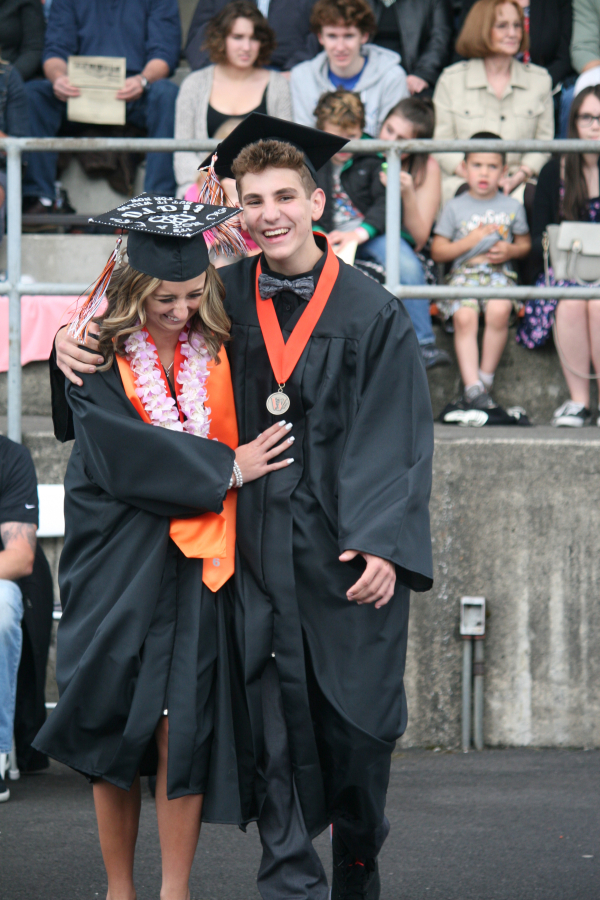 WHS graduates entered Fishback Stadium, two-by-two, greeting each other with hugs and handshakes, as the WHS band performed "Pomp and Circumstance."