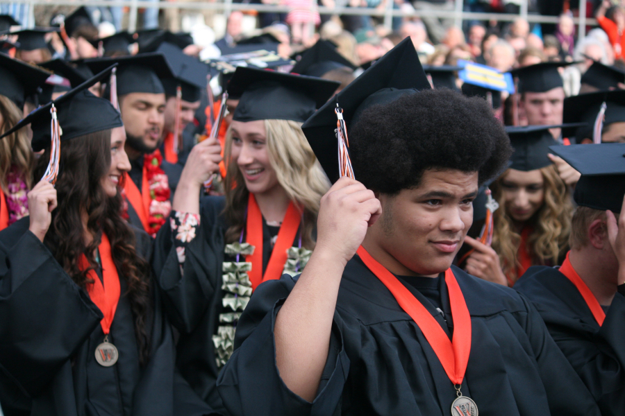WHS graduates prepare to turn the tassels, toward the end of commencement Saturday, at Fishback Stadium. 