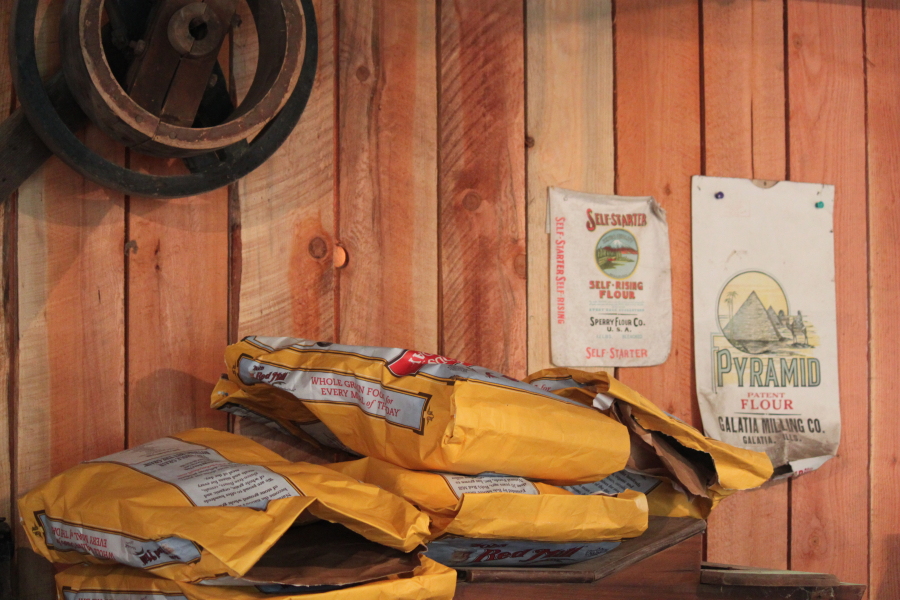 Grain, often donated by Bob's Red Mill, is ground into corn meal during demonstrations at the Cedar Creek Grist Mill.