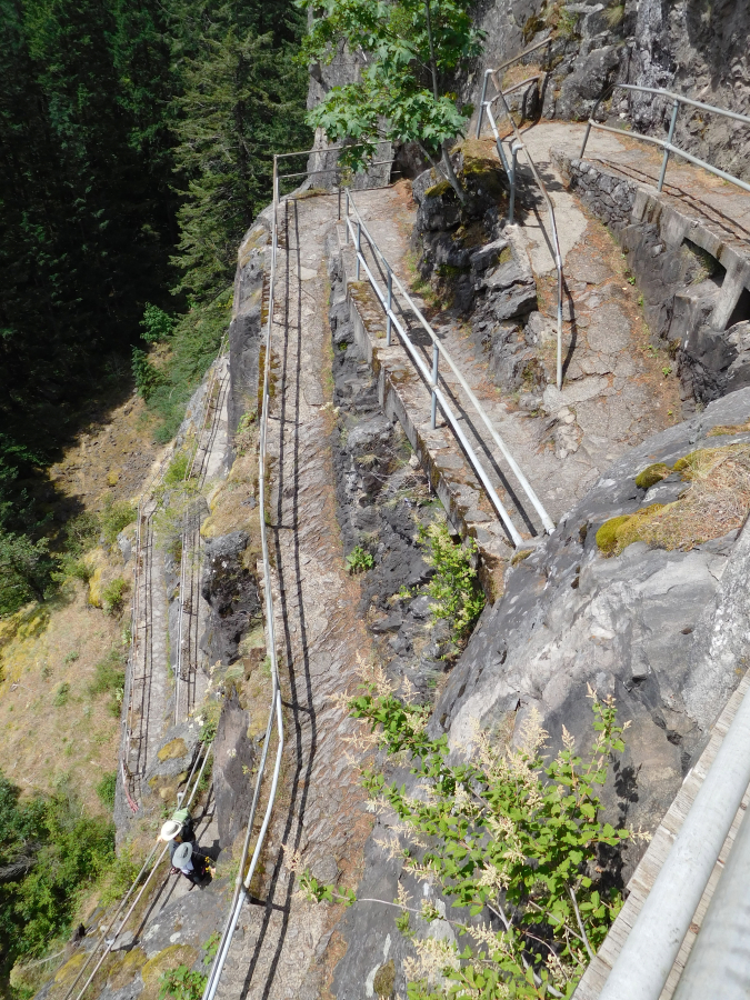 The Beacon Rock trail climbs 848 feet in nearly a mile and is composed of basalt. Henry Biddle purchased the rock in 1915 for $1 and during the next three years, constructed a trail with 51 switchbacks, handrails and bridges.