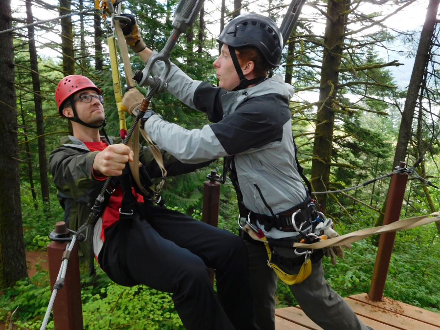 A guide locks a first-time zip-liner into place during a Skamania Lodge Zip Line Tour. For $99 per person, two guides will take groups of up to 10 people through seven different lines ranging from 100 to 900 feet in length. 