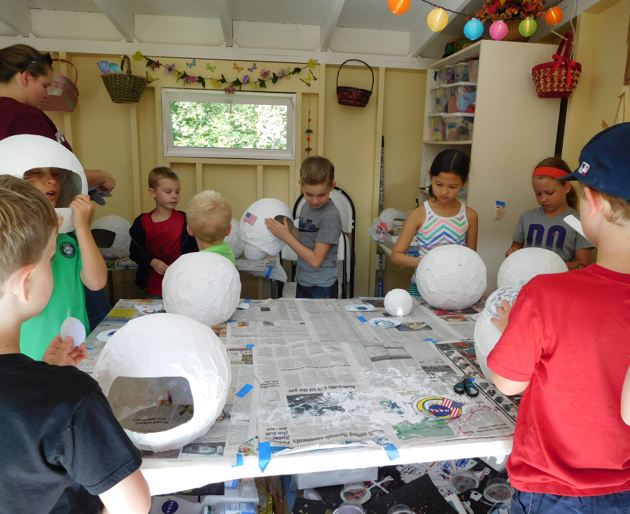 Campers create art projects in a crafts cottage at Camp Windy Hill.  Marty is offering seven camps this summer.