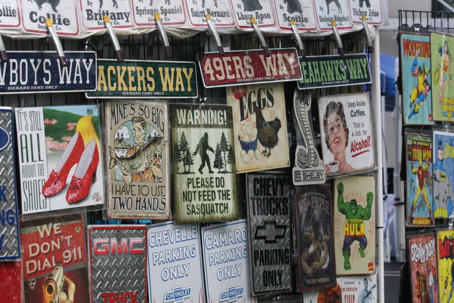 Vintage signs from the company Image Works adorn a booth at the  Camas Days festival on Friday and Saturday.
