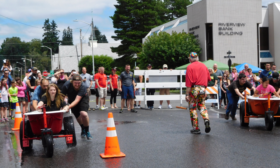 Two teams from Lutz Hardware advanced to the finals of the bathtub races Saturday. The Lutz No. 2 team won, after Lutz No. 1 ran into one of the cones.