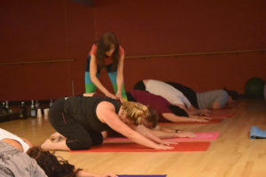 Stephana Johnson, owner of Yogilachi Fitness, facilitates a class in her studio. The new business offers a blend of fitness styles in order to meet customers' needs.