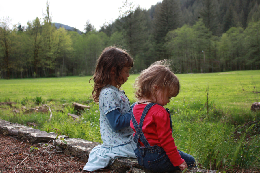 Velah and Zeyah Costello enjoy a quiet moment at the Nature Explorers Camp at Washougal's Kiwanis Camp Wa-Ri-Ki. (Contributed photo)