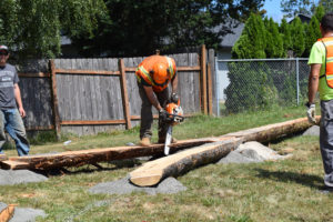 Nat Lopes, of Hilride Progression Development Group, works on a log feature at Hamllik Park, in Washougal. The first stage of the new bike track was completed during a community work party, Aug. 6 and 7.