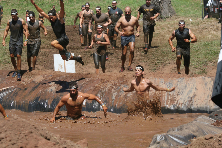 Spartans rejoice as they reach the finishing chute Saturday, at Washougal Motocross Park. More than 6,000 competitors completed the 4.3-mile course filled with 23 different obstacles. 