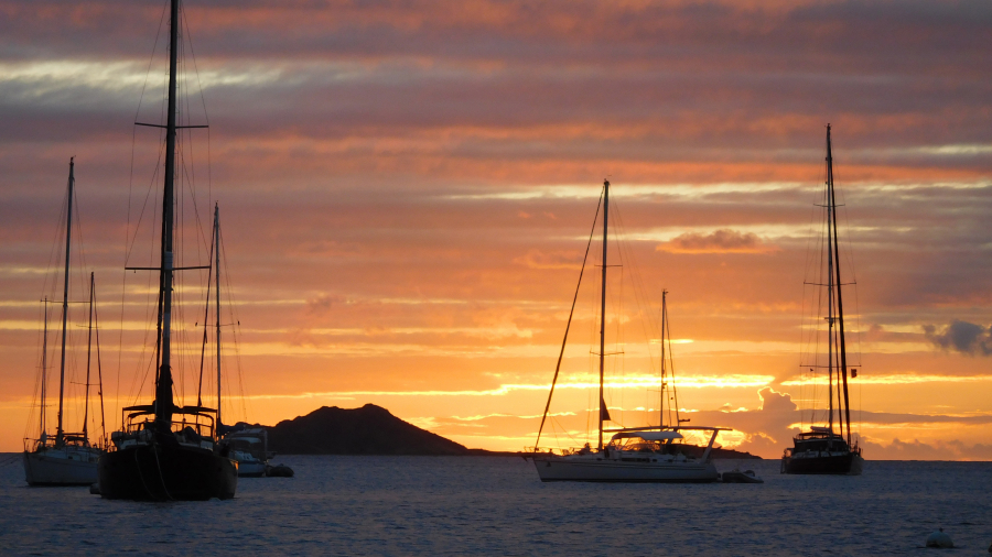 Sailboats frame the sunset in a harbor in the British Virgin Islands. (Contributed photo)