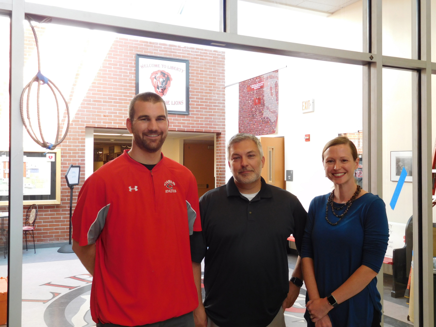 From left, Stephen Baranowski, associate principal, Gary Moller, principal, and Nicole O'Rourke, dean of students, stand in the entrance of the new vestibule at Liberty Middle School.