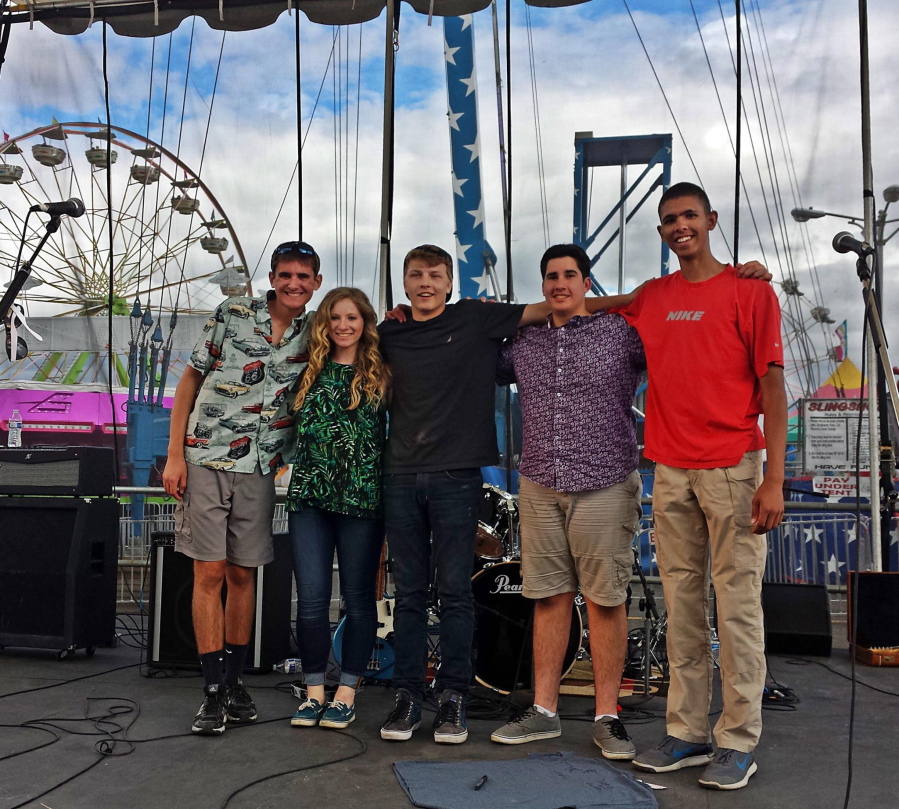 Simply 8 was formed in February out of a desire to produce music that is meaningful and contains lyrics that everyone can enjoy. Here, band members relax after a performance at the Clark County Fair. 