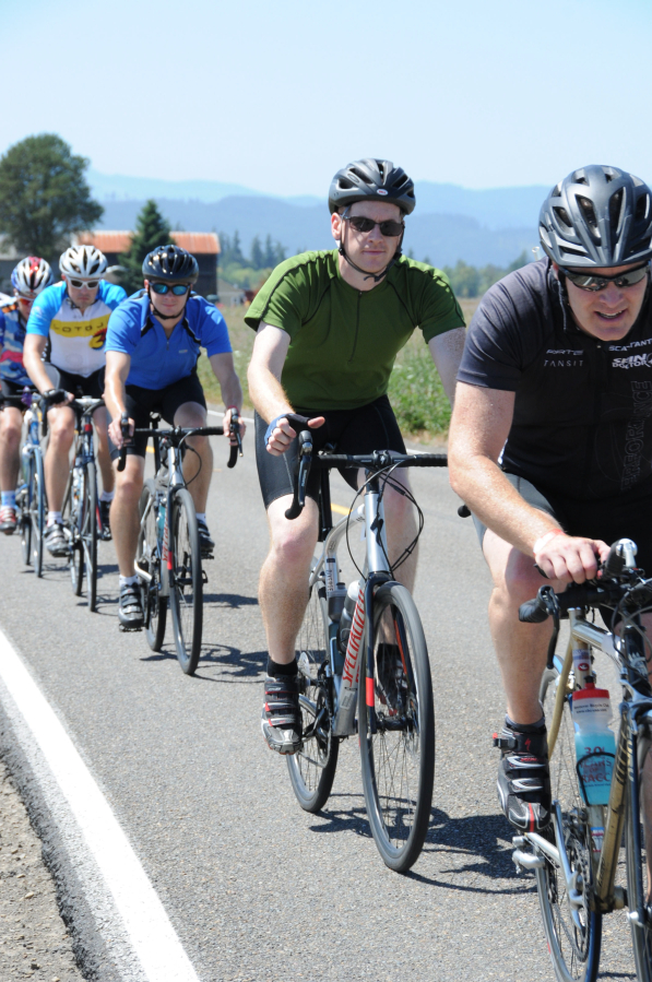 Cyclists conquer a hill during the Tour de Cure, held Saturday, July 30, at Amber Glen Park in Hillsboro. It features distances ranging from 10 to 104 miles, and a 3 mile walk option. (Contributed photo)