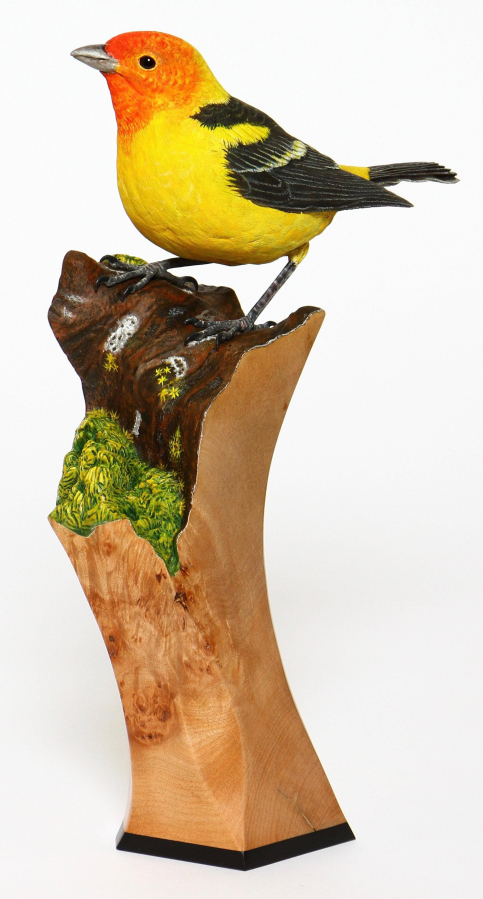 A wood sculpture by Donald Baiar sits on display.