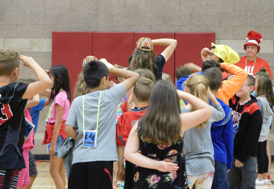 Students participate in the "Titanic" game, where the emphasis was on involving everyone in the activity. They are led by lead facilitator Joe Fenbert.