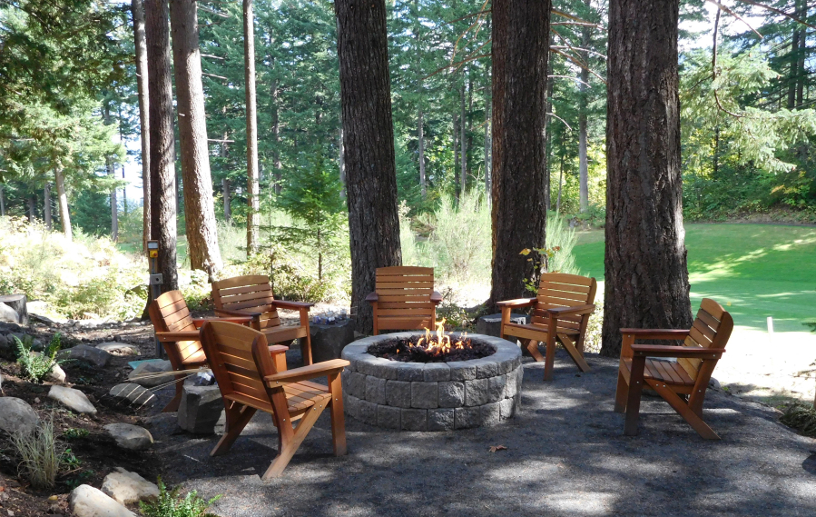 A fire pit is shared between treehouse guests and is perfect for roasting s'mores, having a glass of wine at night, or just relaxing.